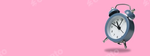 Preview: Spring Forward. Alarm clock on a pink background, with space for text.
