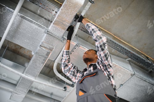 Preview: African American Hvac technician installing air duct, ensuring proper ventilation