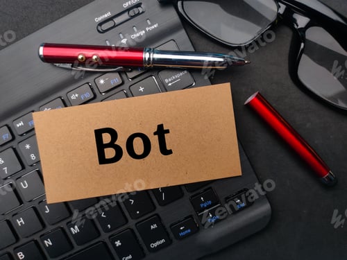 Preview: Keyboard and pen with the word BOT on black background.