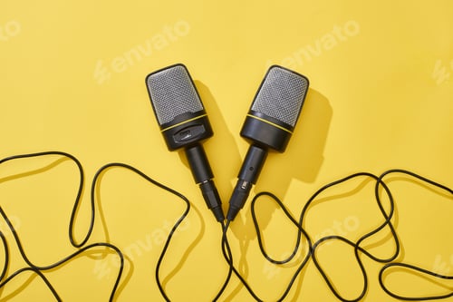 Preview: top view of microphones on bright and colorful background with copy space