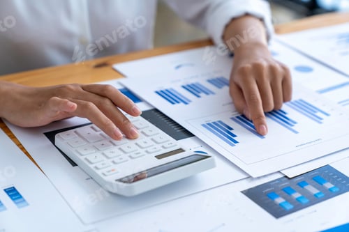 Preview: businesswoman working on desk office with using a calculator to calculate the numbers, calculating m