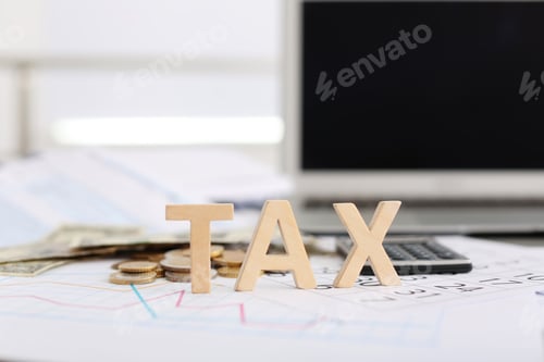 Preview: Word TAX, money and calculator on table