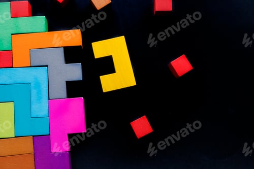 Preview: Different colorful shapes wooden blocks on black background, flat lay.
