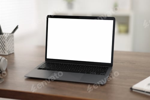 Preview: Laptop with blank screen on wooden table indoors, Space for text