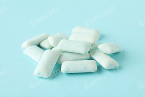 Preview: Chewing or bubble gum on blue background