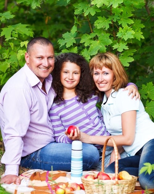 Preview: Happy young family with daughter on picnic