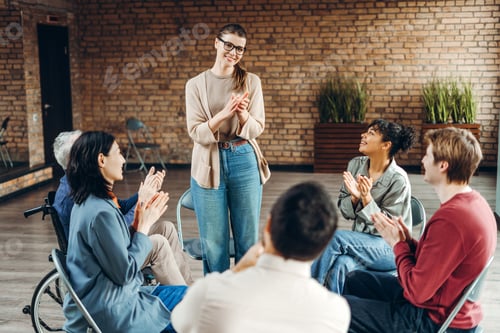 Preview: Diverse team clapping for coach after successful training session