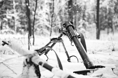 Preview: German mine-thrower mortar of times of the second world war in snowy winter forest. Wehrmacht weapon