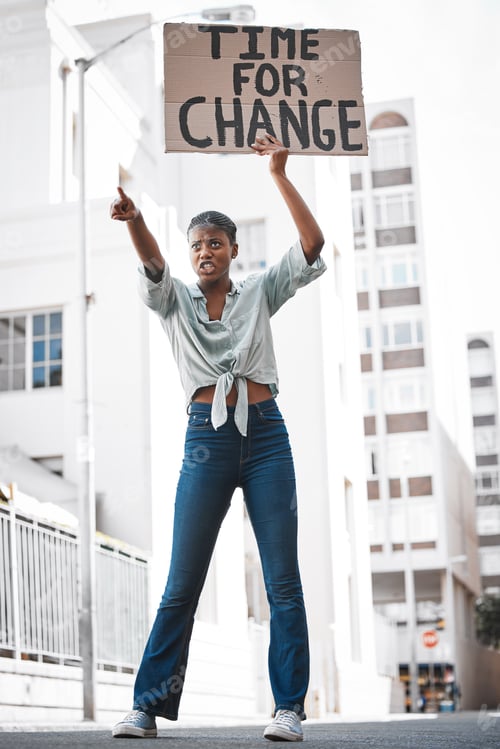 Preview: Feminism is for everybody. Shot of a young woman protesting in the city.