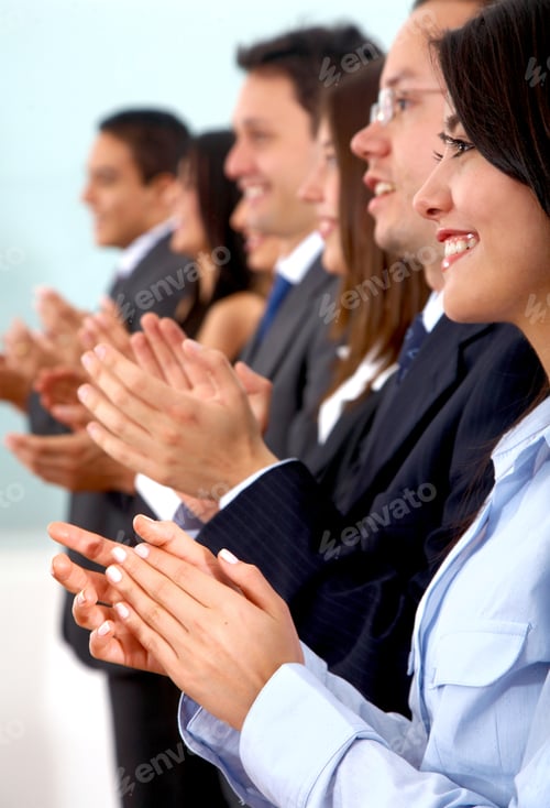 Preview: Business Team Clapping A Good Presentation In An Office