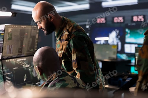 Preview: Military officer and coworker operating radar systems
