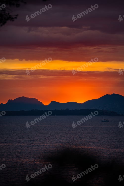 Preview: Dramatic scenery of a beautiful sunset in the sky over the sea in Cannes, France