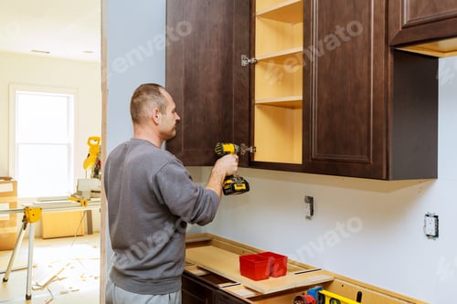 Preview: Installation of furniture hinges on the cabinet door kitchen view installed in a remodeling