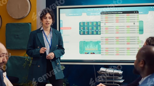 Preview: Marketing specialist evaluating market trends by studying infographics