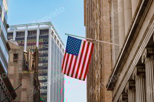Preview: American Flag Hanging Between Downtown Buildings