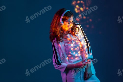 Preview: Woman enjoying music with smartphone