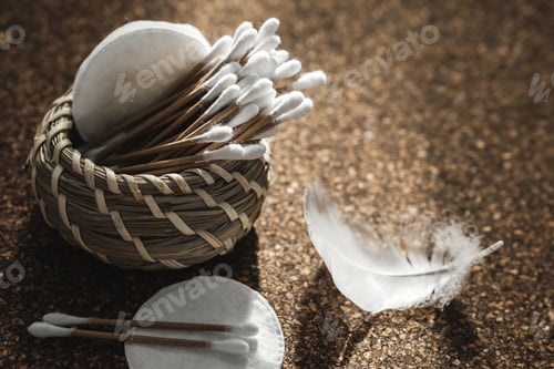 Preview: Wooden Cotton Swabs in Woven Basket on Cork Surface