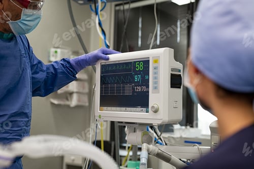 Preview: Surgeon checking heartbeat on monitor