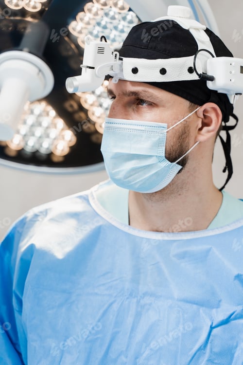 Preview: Male Doctor Wearing Surgical Mask and Headgear