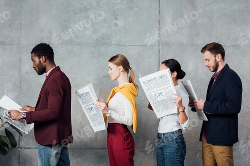 Preview: multiethnic casual businesspeople reading newspapers in waiting hall