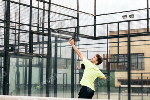 Preview: young man playing paddle tennis