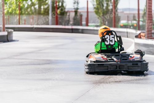 Preview: Young child competing in a go kart race