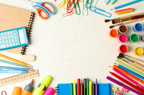 Preview: Flat lay composition with school supplies on white background, space for text