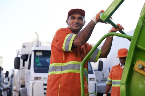 Preview: Keeping the city clean. Cropped shot of a team of garbage collectors.