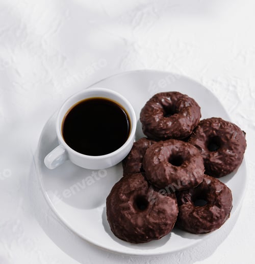 Preview: cookies in chocolate glaze with cup of coffee