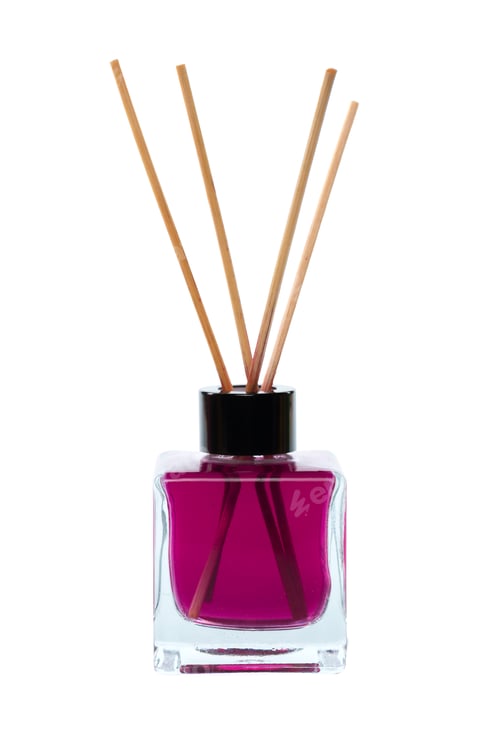 Preview: Fragrant reed diffuser with purple liquid placed on a white background