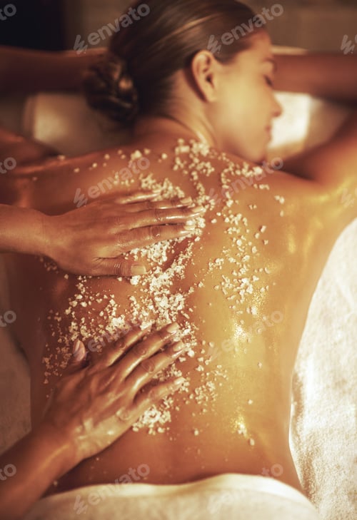 Preview: Cropped shot of a young woman getting an exfoliating treatment at the spa