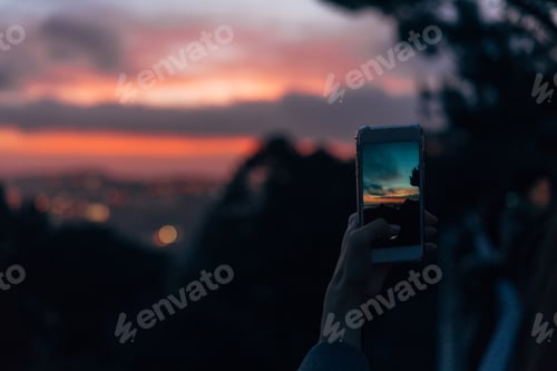 Preview: Young woman taking photo
