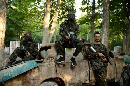 Preview: Paintball team, friends poses on playground