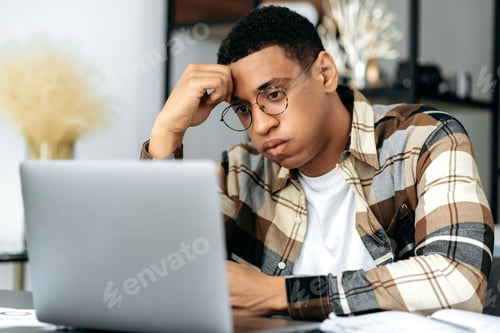 Preview: Upset frustrated hispanic guy, office worker or freelancer, have trouble, negative mood, worried