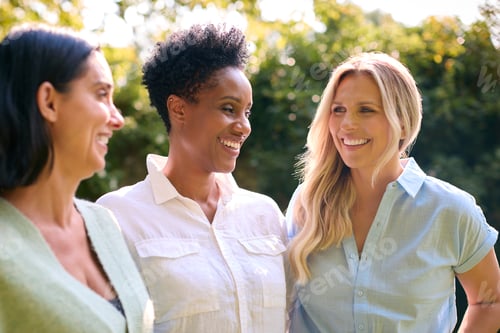 Preview: Three Smiling Mature Female Friends Outdoors Spending Time In Countryside Together