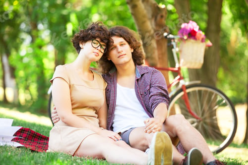 Preview: Couple with retro bike in the park