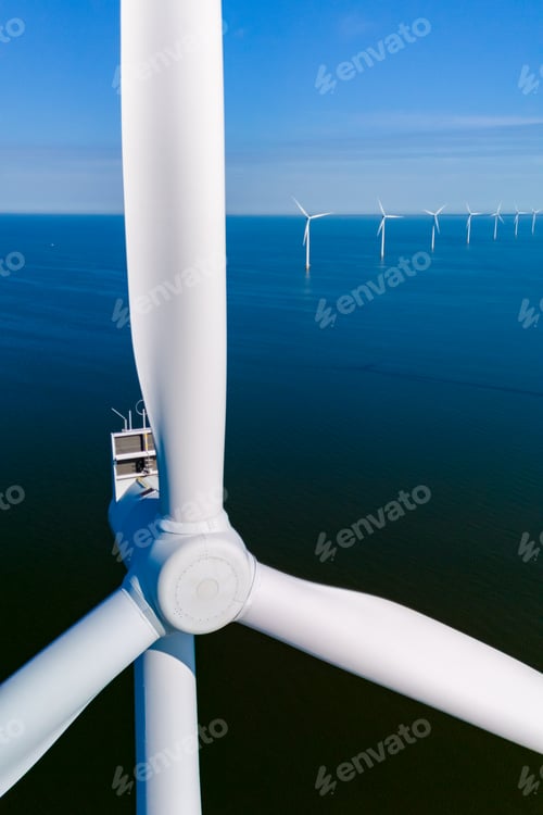 Preview: Wind Turbines Harnessing Renewable Energy Offshore in the Netherlands Under Clear Blue Skies