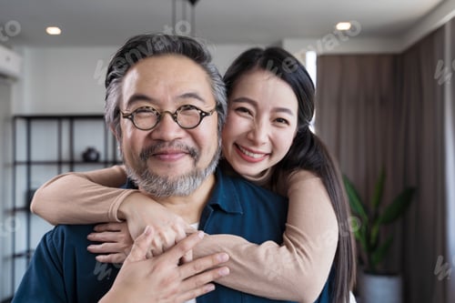 Preview: Closeup Middle-aged Asian couple smiling for the camera. Family couple portrait
