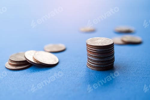 Preview: Stack coin,Money with blur Pile Cash on Blue Background