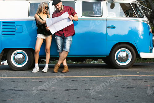 Preview: People Checking The Map for Direction on Road Trip