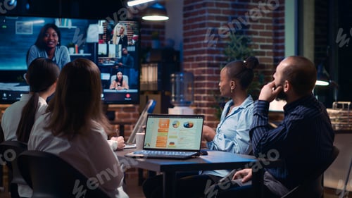 Preview: Employees greeting remote team in videoconference