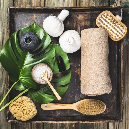 Preview: flat lay layout with monstera leaves and cosmetic care products