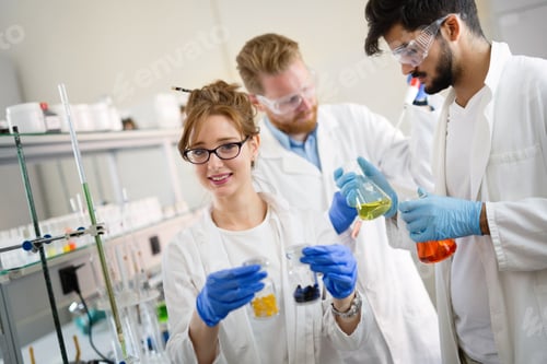 Preview: Young students of chemistry working in laboratory