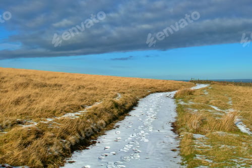 Preview: Picturesque winter scene featuring a snow-covered hill in Dartmoor National Park, UK