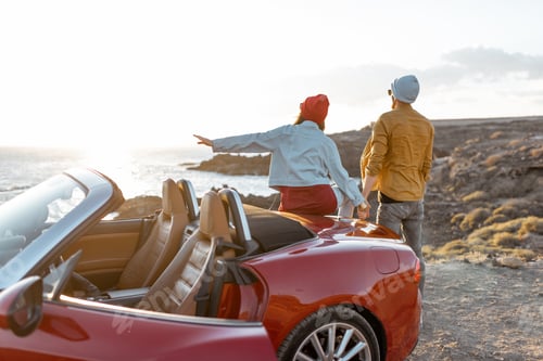 Preview: Lovely couple traveling by car near the ocean