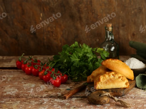 Preview: baked pies for snack on wooden table