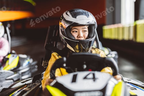 Preview: Woman in Go Kart Racing with Helmet On