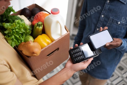 Preview: Close up of man paying for grocery delivery