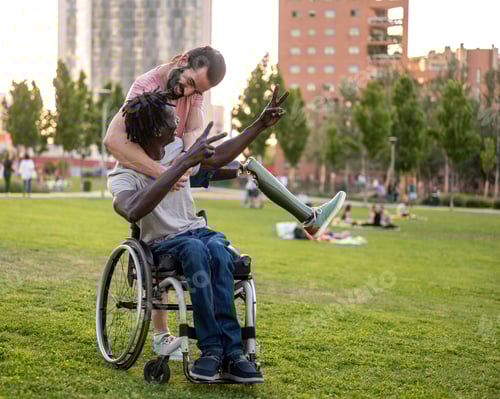 Preview: People with different disabilities joke outdoors in the city park