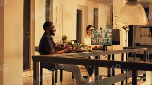 Preview: African american worker attending corporate videocall meeting